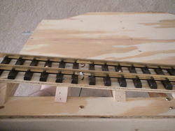 Shows electrical wiring from table to track.  Also good picture of trusses.