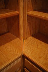 Close up of lower interface between center and side bookshelv